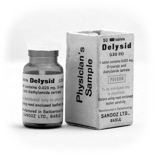 A small glass bottle and a cardboard box of Delysid (LSD 25) tablets from Sandoz Ltd., Basle. The labels read: 1 tablet contains 0.025 mg D-lysergic acid diethylamide tartrate; Poison; To be distributed only to physicians; Physician's Sample.